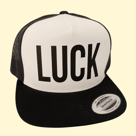 Black LUCK on a Black and White Trucker Cap